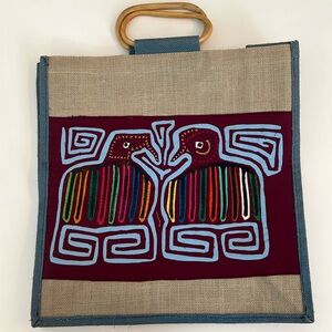 NWOT Panamanian Burlap Bag with beautiful bird design and wooden handles.